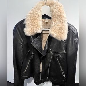 Burberry leather jacket with lamb skin and a shearling collar . Size 34.